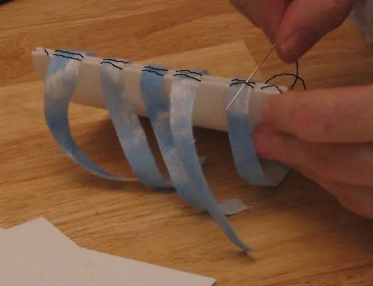 Détail du fil de couture entre deux cahiers de livre.